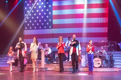 country tonite cast in front of american flag