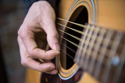 person playing guitar