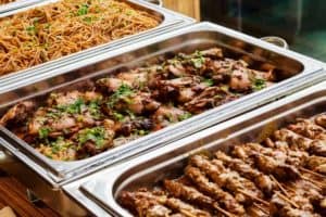 trays of food at a buffet
