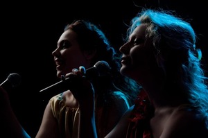 Singers on stage at the NACMAI country music competition in Pigeon Forge