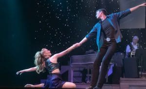 couple dancing onstage at our Pigeon Forge show